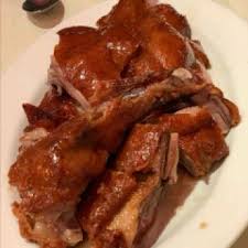 Shanghai Terrace signature dishes Peking Duck, Dim Sum, Imperial Hot and Sour Soup, XO Scallops